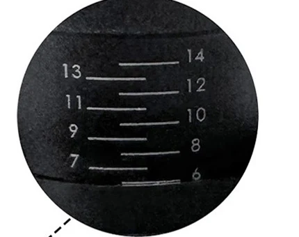 Close-up of the adjustment collar showing engraved graduations from 6 to 14