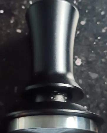 Calibrated coffee tamper photographed at home by a verified buyer — Straight 51mm