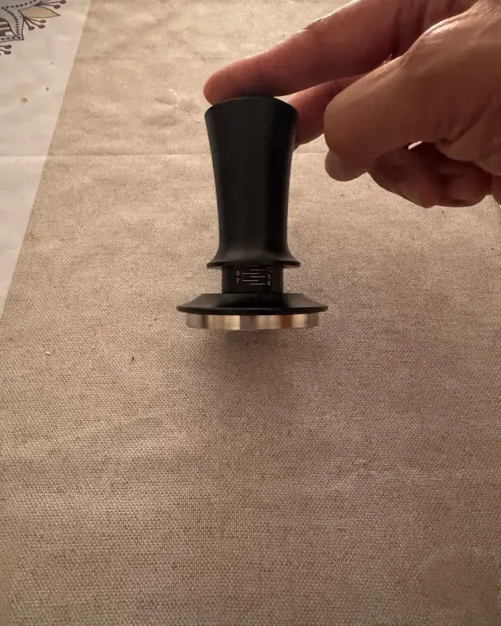 Calibrated coffee tamper photographed at home by a verified buyer — Straight 51mm