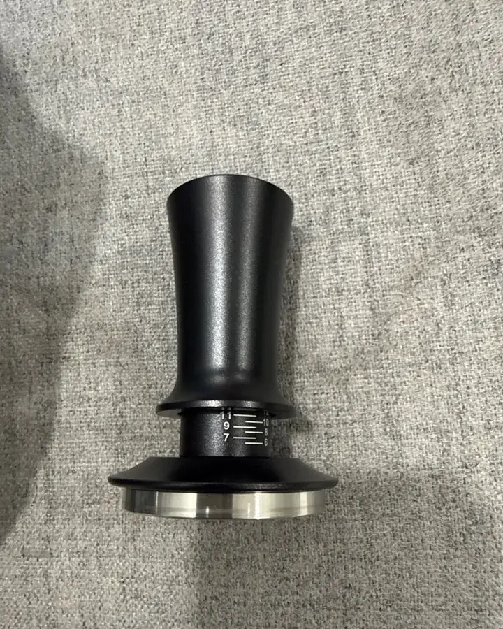 Calibrated coffee tamper photographed at home by a verified buyer — Straight 51mm