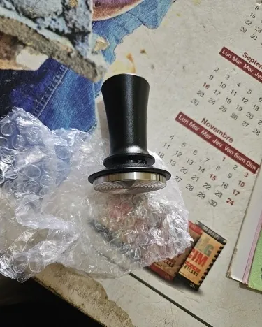 Calibrated coffee tamper photographed at home by a verified buyer — Straight 51mm