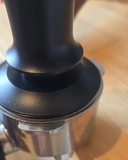 Calibrated coffee tamper photographed at home by a verified buyer — Straight 51mm