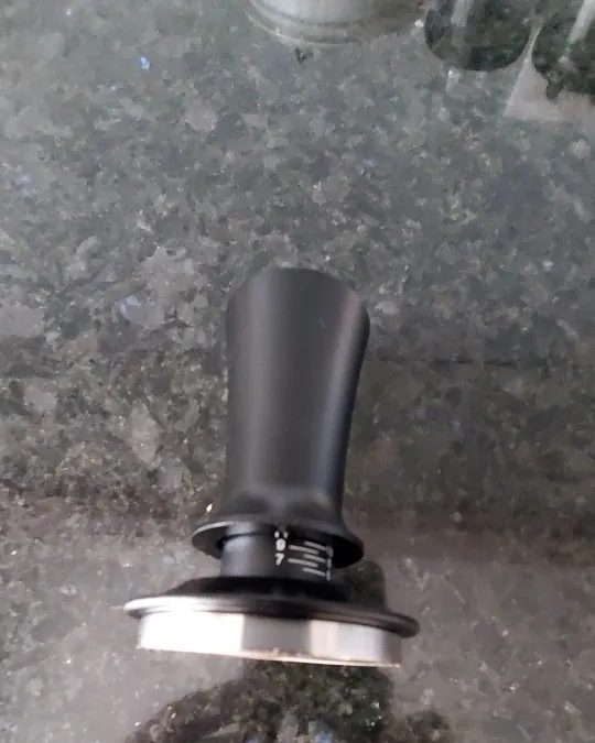 Calibrated coffee tamper photographed at home by a verified buyer — Straight 51mm